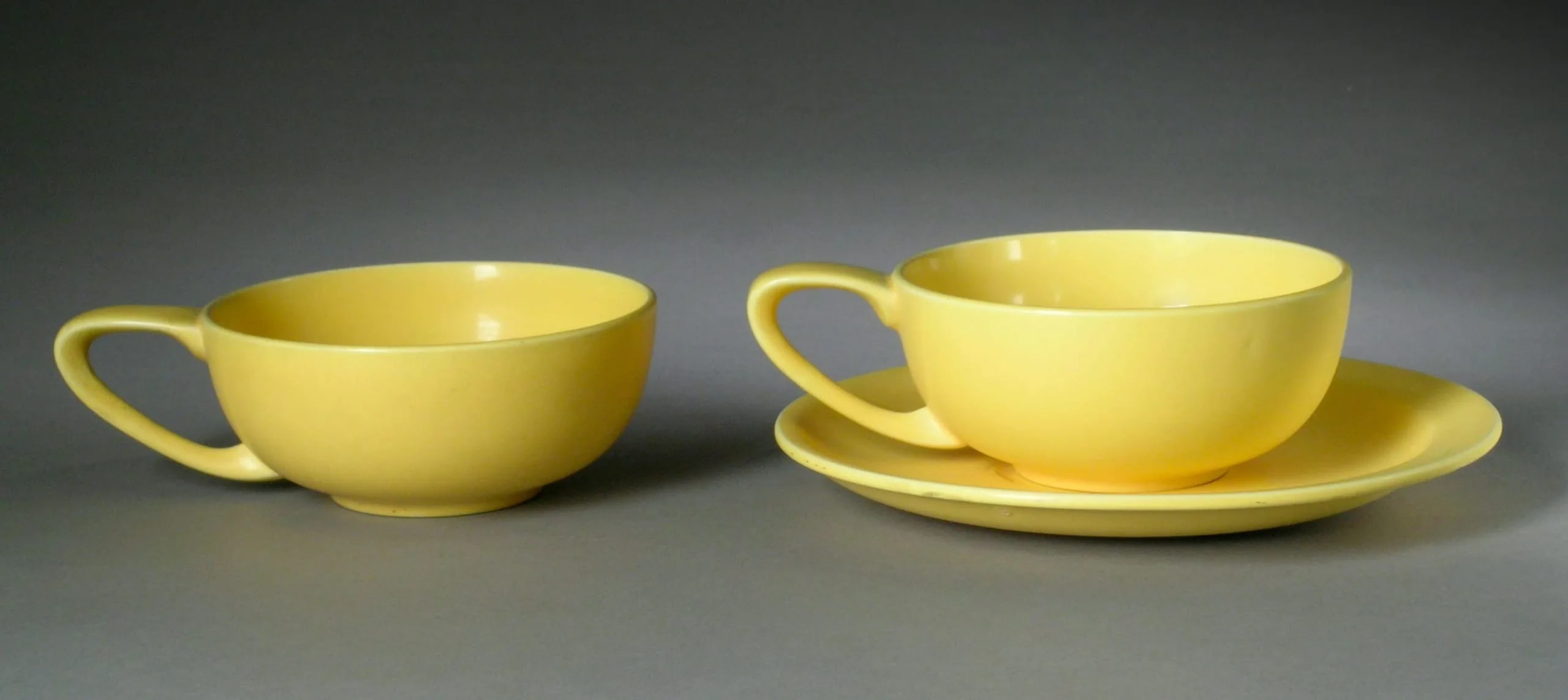 Two Arc Handle Cups and one Saucer