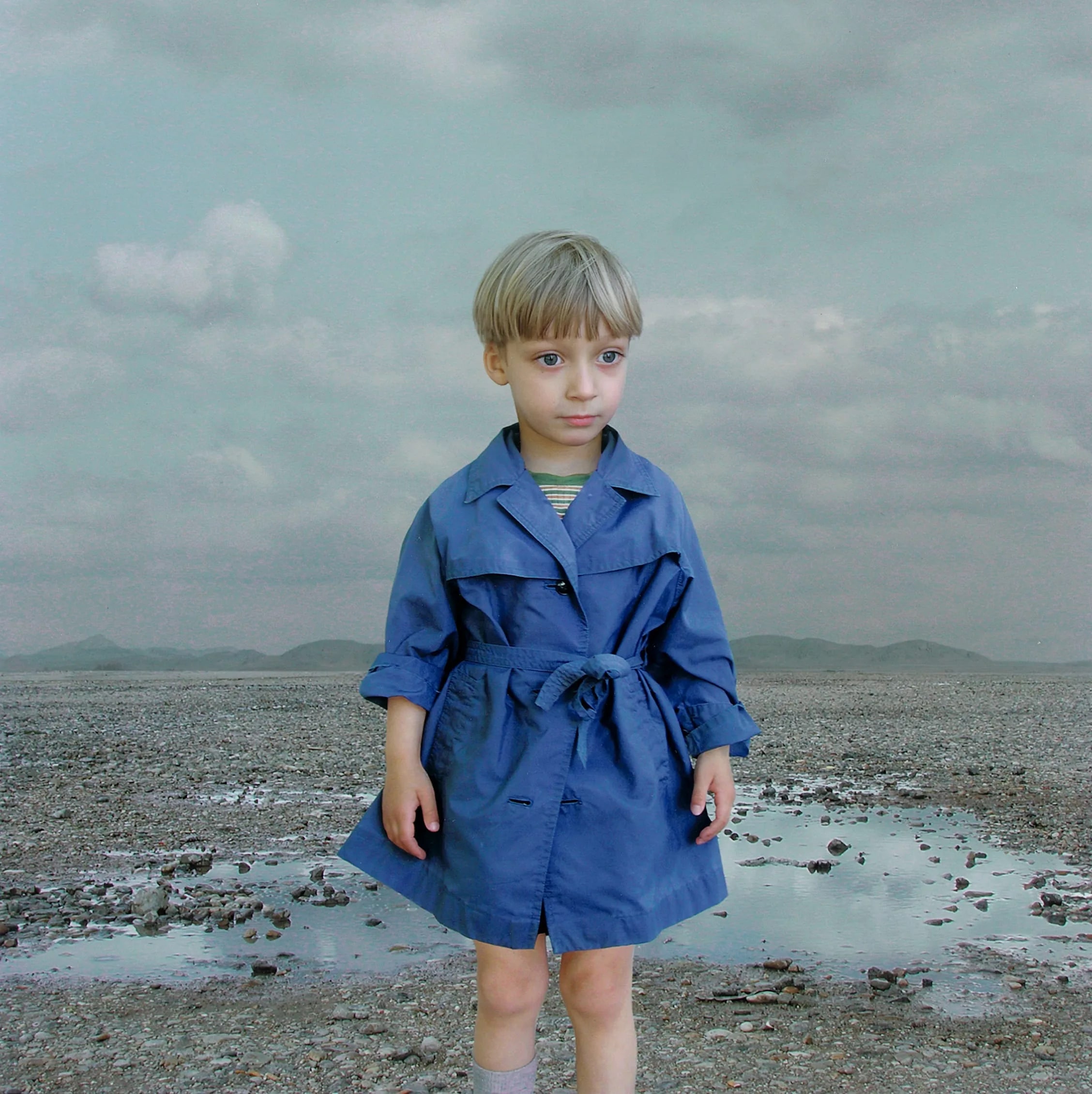 Boy in a Blue Raincoat 1