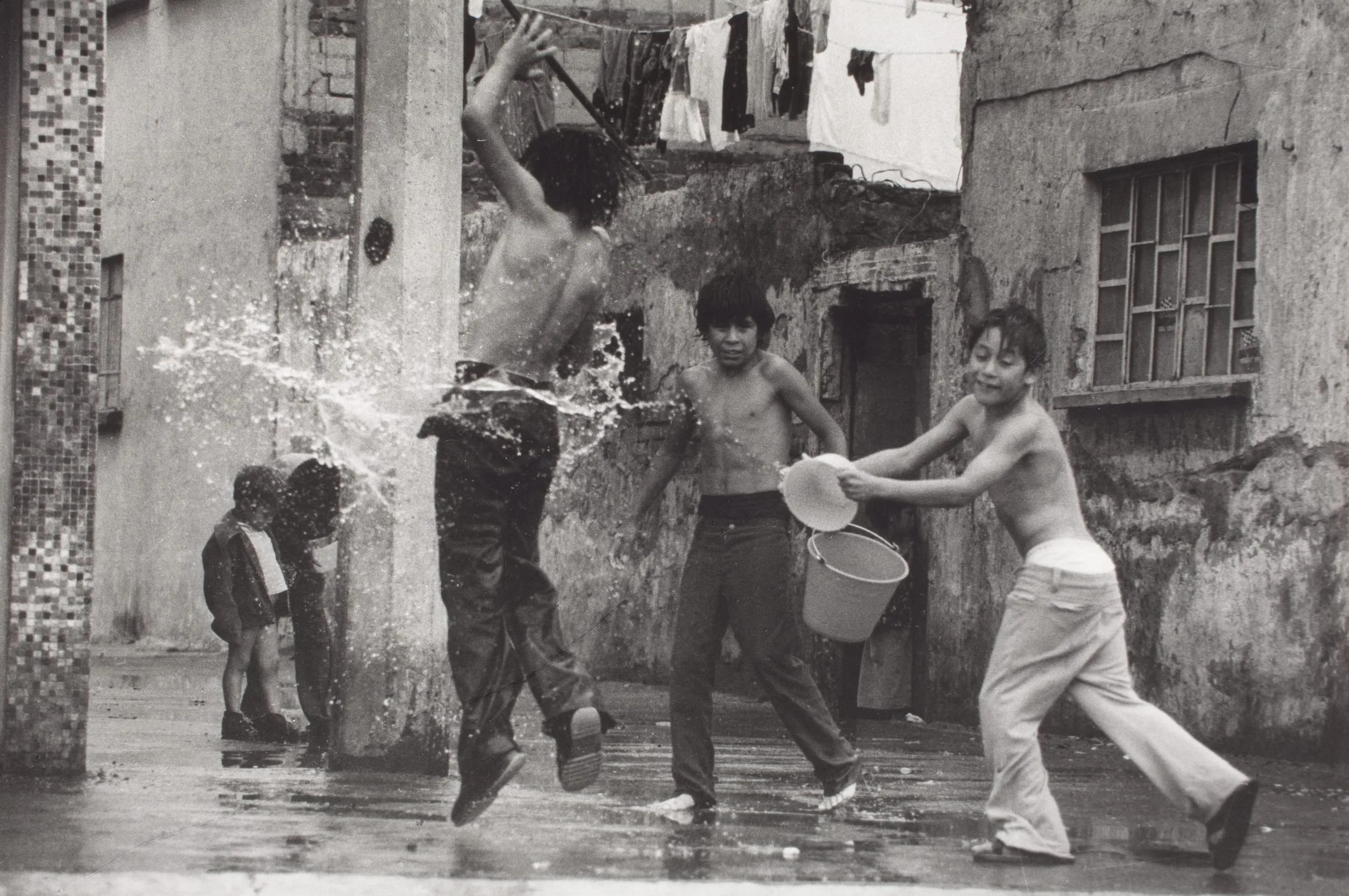(Boys Playing in Street with Water)
