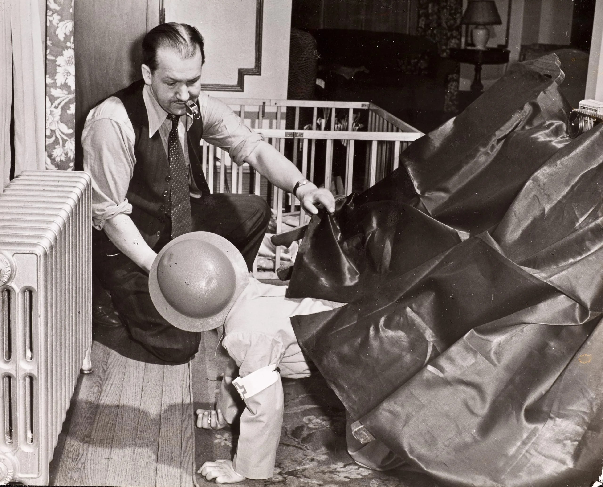 Eugene Mott using whistle to teach his children instinctive recognition of air raid signals, Queens Village, NY, 1941