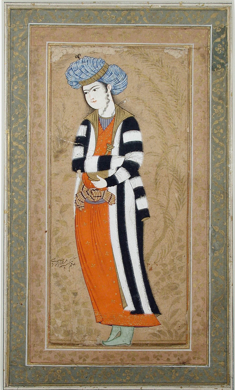 A standing youth in a striped coat