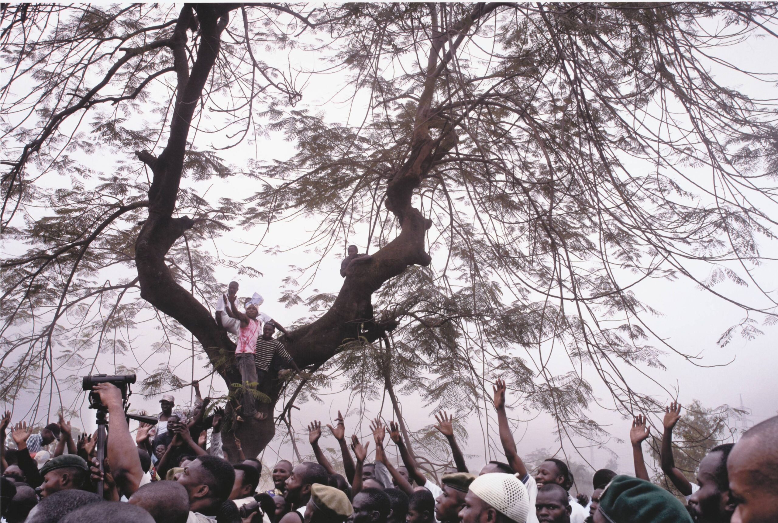 Supporters of Jean-Pierre Bemba line the road as he walks to a rally from the airport, Kinshasa, July 2006