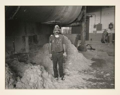 Jose Cumba under the boiler where rags are bleached, at the Parsons Paper Company, Holyoke, Massachusetts
