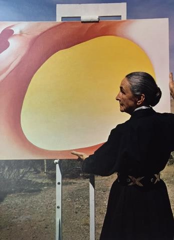 Georgia O'Keeffe with a canvas from her 'Pelvis Series- Red With Yellow,' Albuquerque, New Mexico