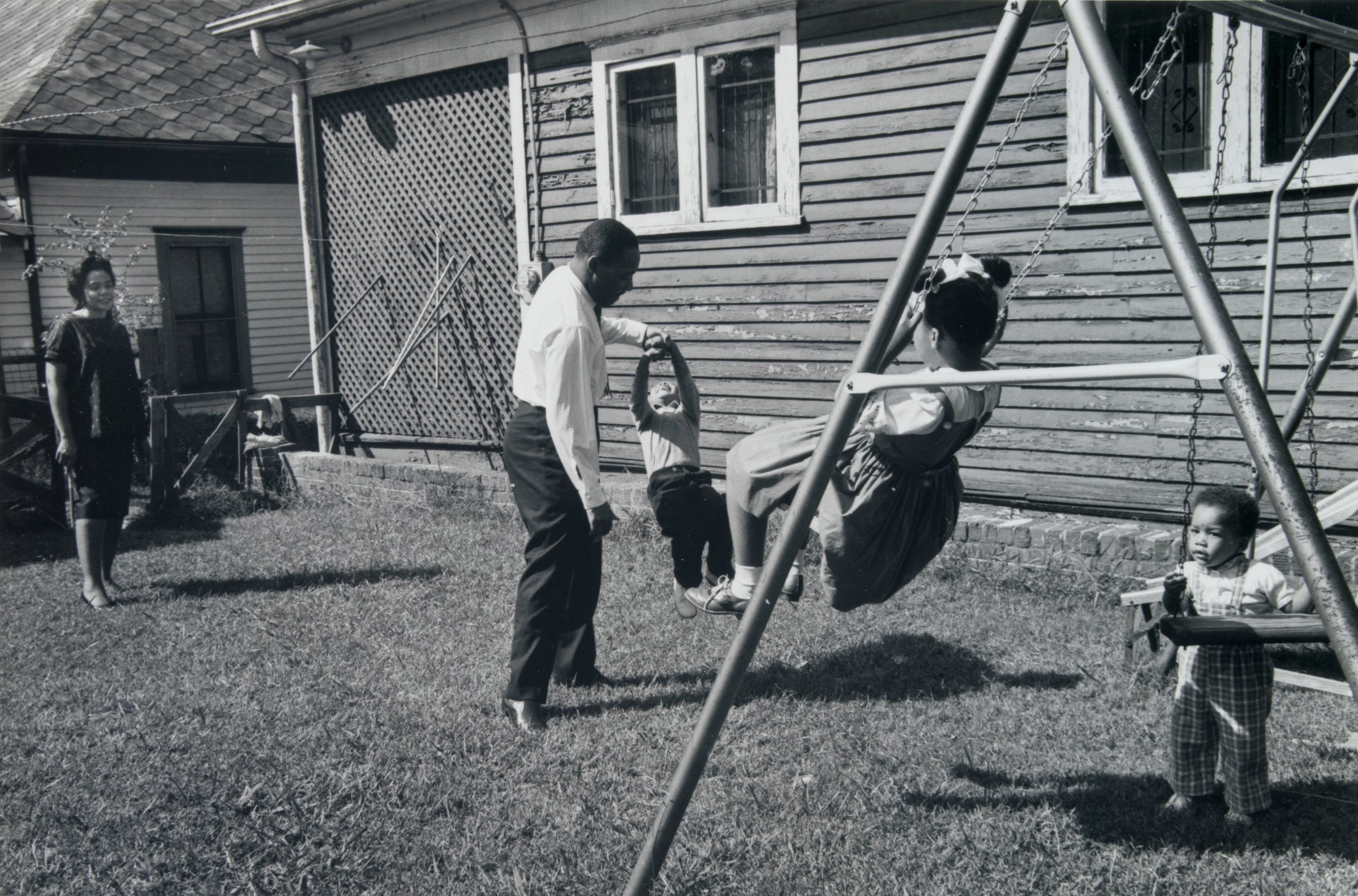 Dr. Martin Luther King Jr. at Home with His Family, 1962 (Swing Set off to Side)