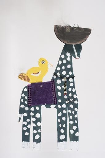 blue giraffe with white polka dots and yellow bird