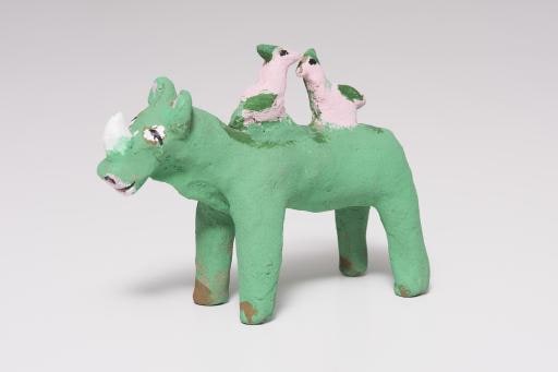 green rhinoceros with two pink birds