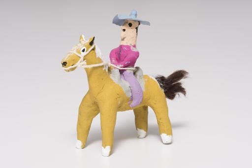 yellow horse with rider