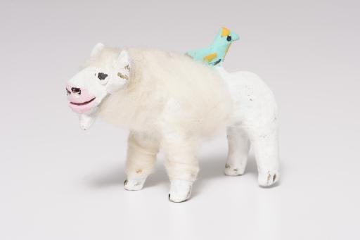 white buffalo with blue green bird