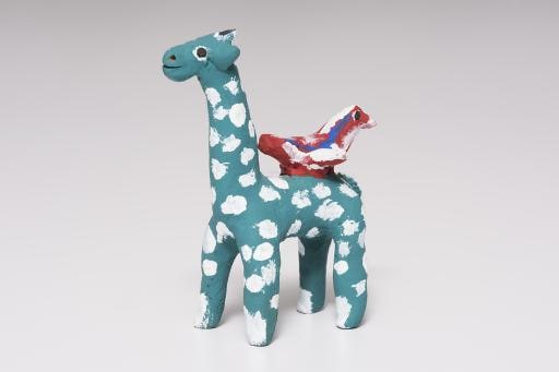 green giraffe with white polka dots and red bird