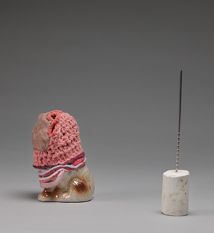 Ceramic Dog with fingerless gloves + Thing from 1994, from the tabletop, "Votive Moderns" series, 1994-present