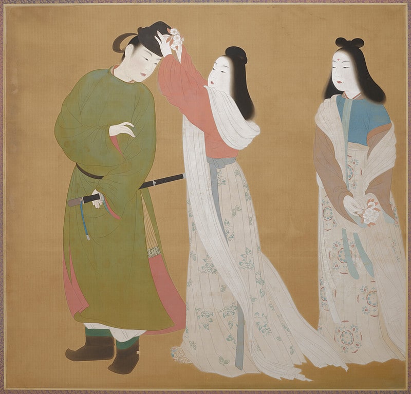 Adorning a Man's Hat with Flowers
