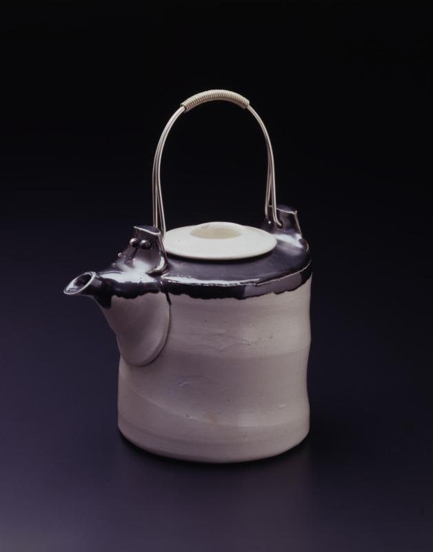 Teapot with metal handle