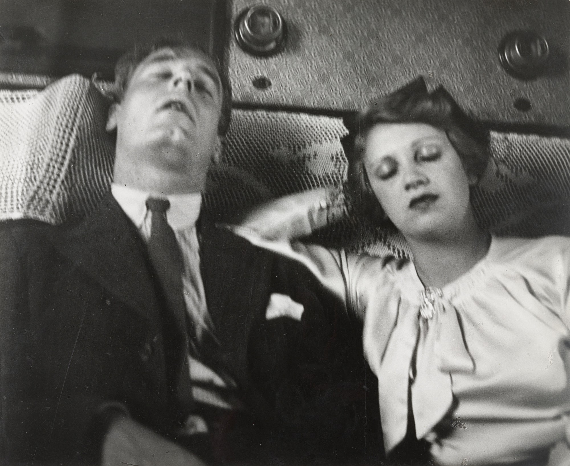 Couple Asleep in a Train