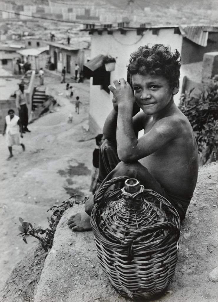 Boy on hillside overlooking Caracas, Venezuela
