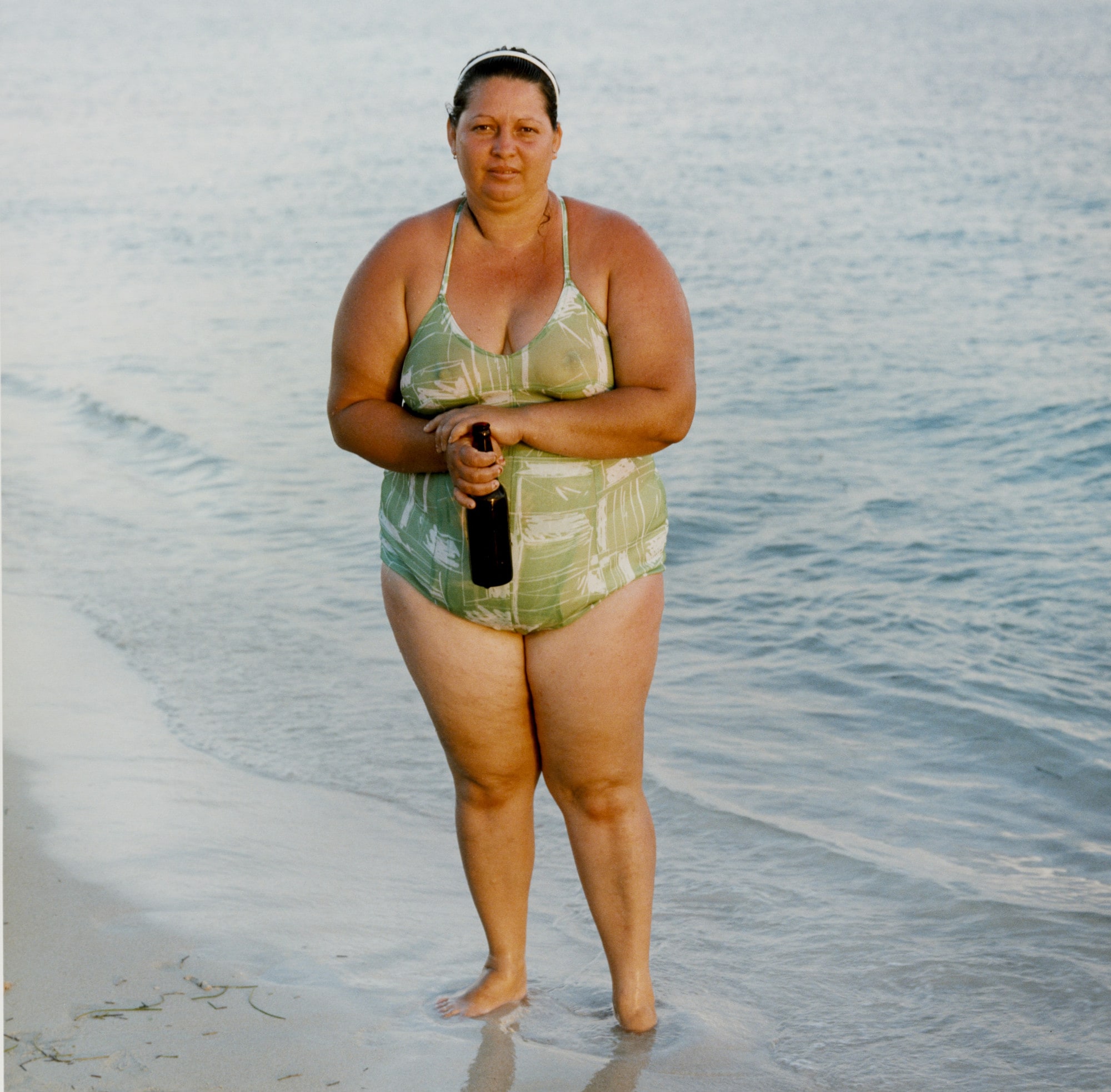Woman Drinking Beer on the Beach, Playa Ancon, Cuba