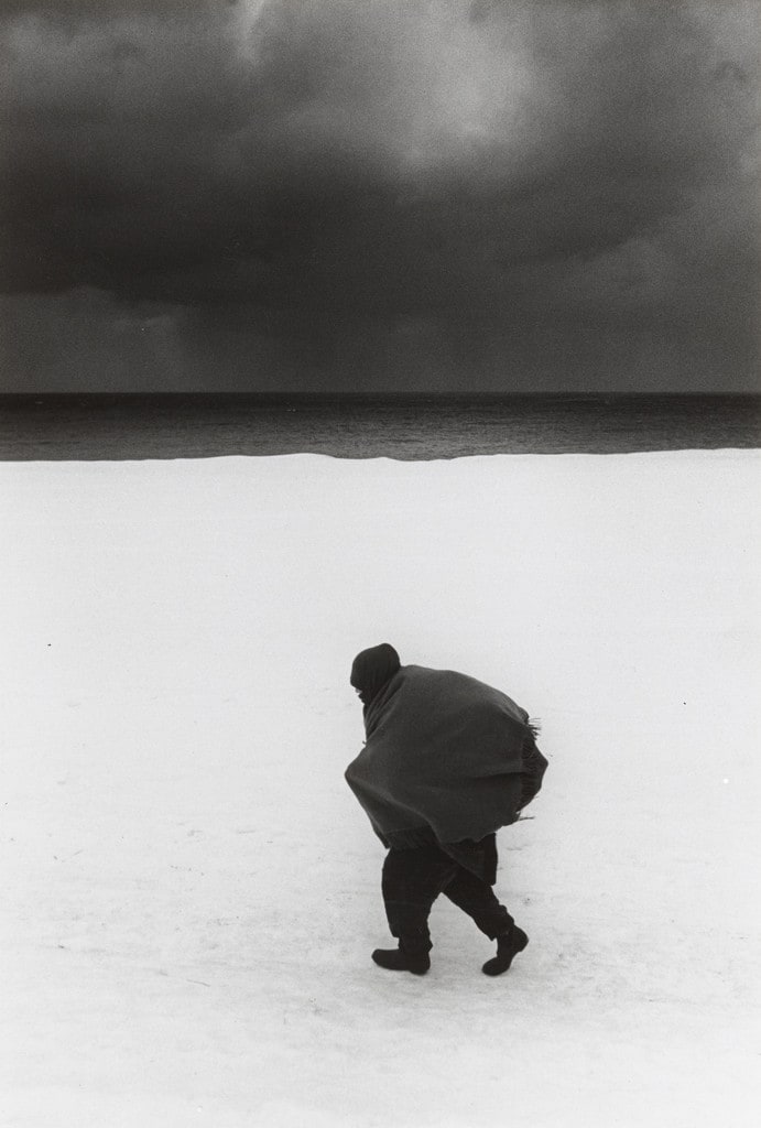 Woman Hurrying on the Snow Road