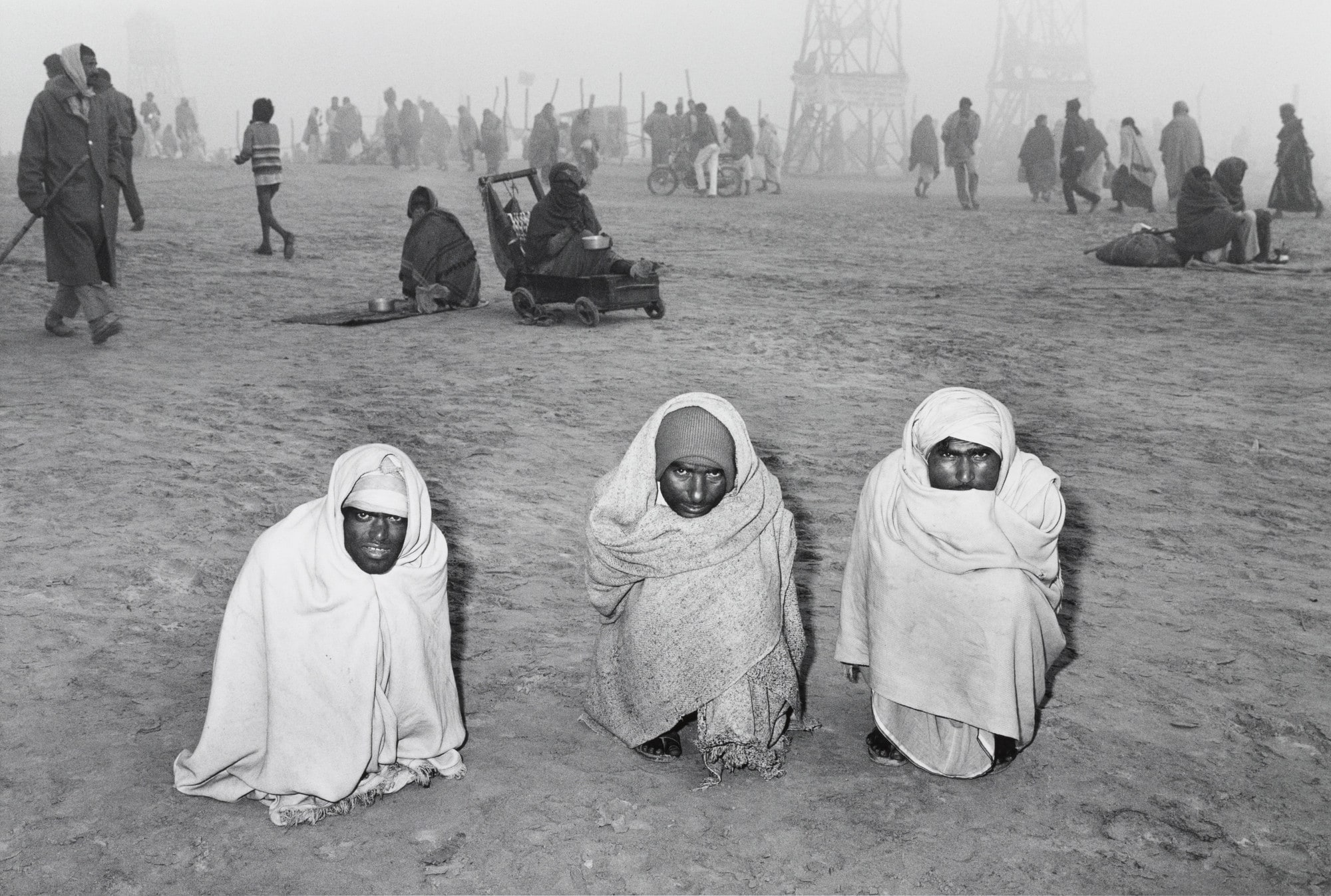 Three Pilgrims at the Sangam, Kumbh Mela, Allahabad, India