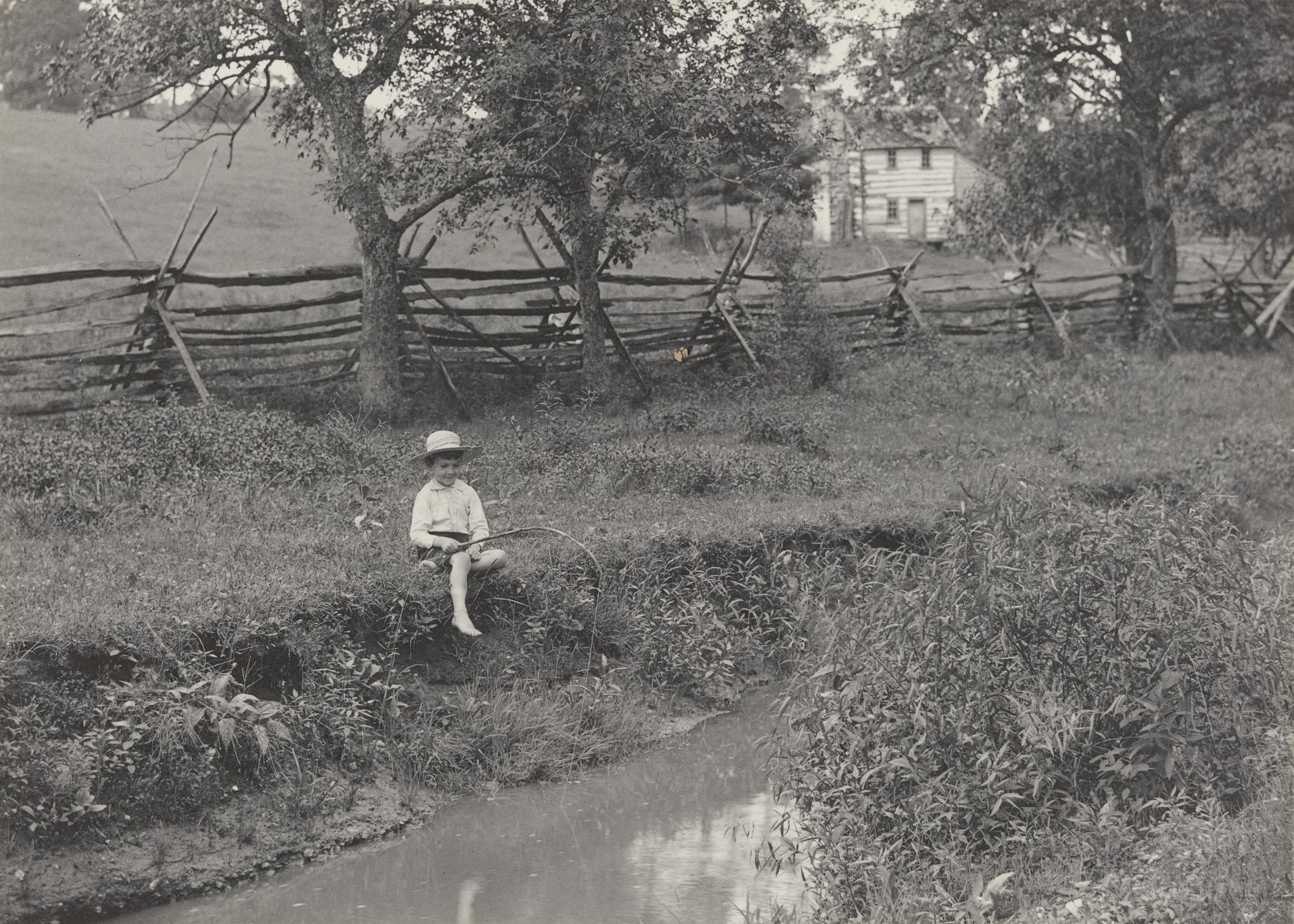 John Fishing on Bank of Stream