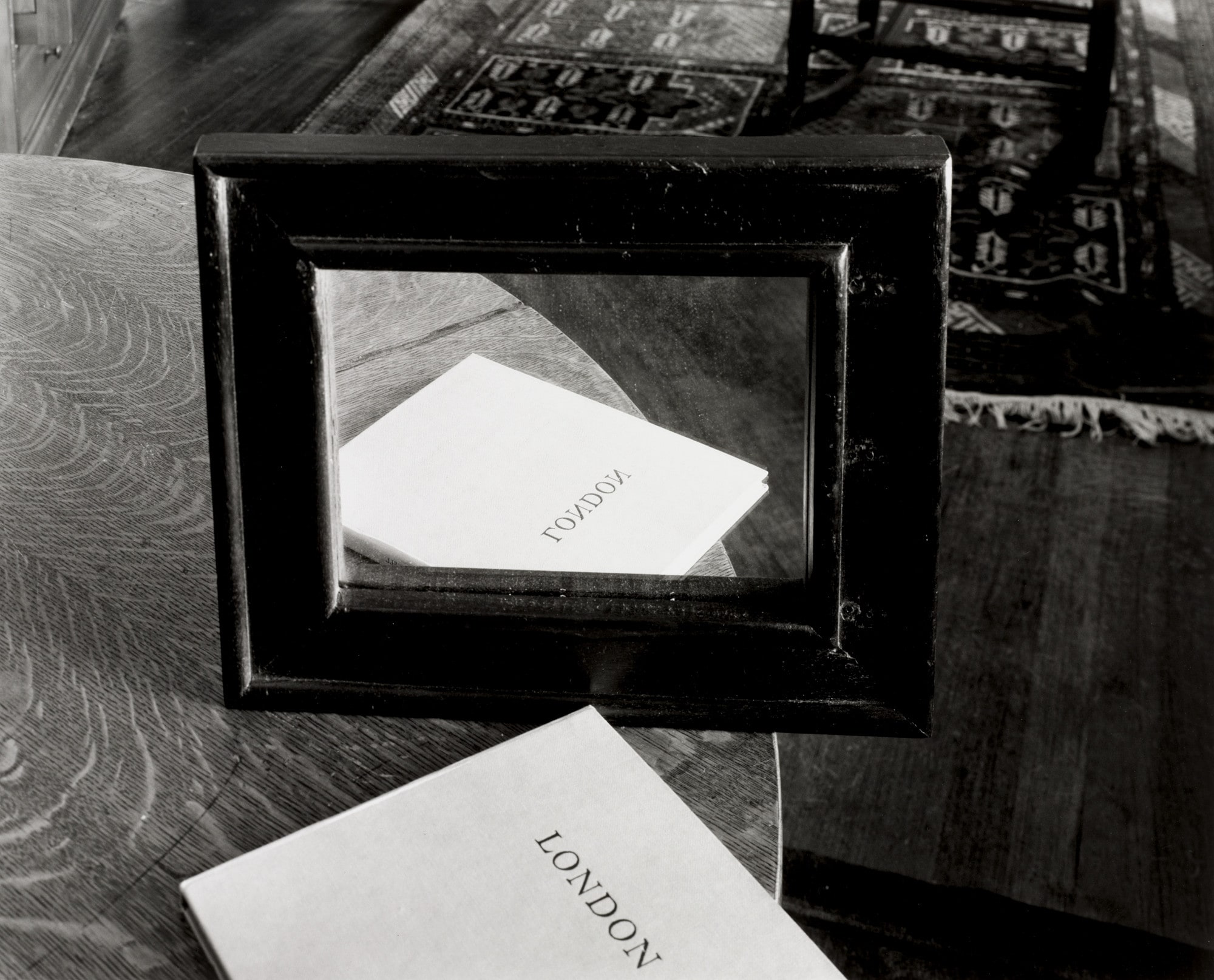 Book and Mirror on Round Table