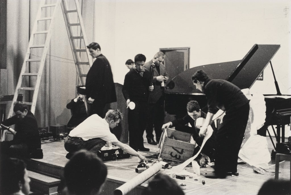 Reading Work Piece No. 1: music while you work, performed during Festum Fluxorum/Fluxus/Musik und Antimusik/Das Instrumentale Theater, Staatliche Kunstakademie, Düsseldorf, February 3, 1963