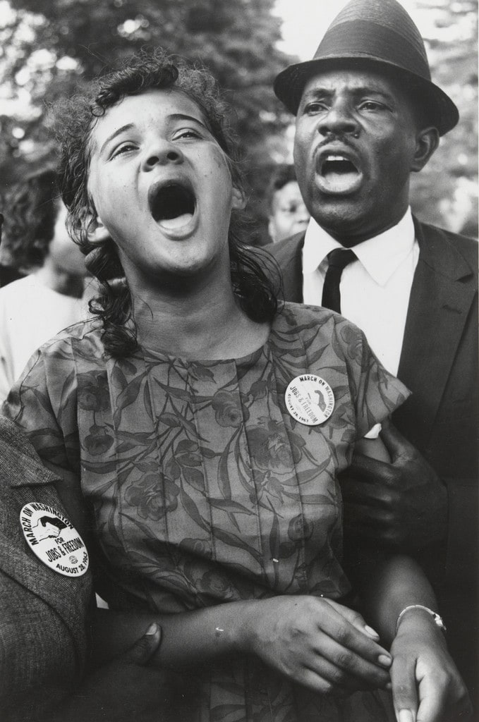 Washington, D.C.: Demonstrators sing "We Shall Overcome" after Dr. Martin Luther King, Jr.'s "I Have a Dream" speech