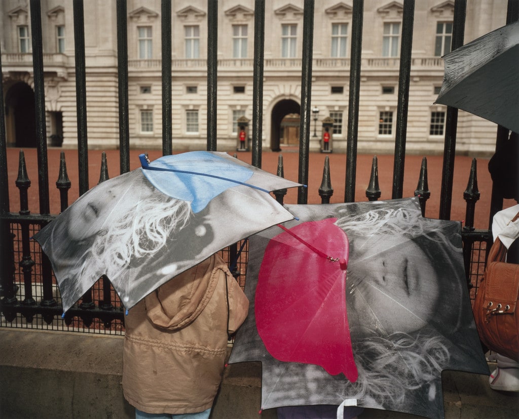 Tourists outside Buckingham Palace in the Rain, London, England