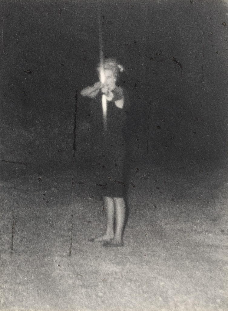 Anita Ekberg surrounded by Paparazzi defends herself with bow and arrow