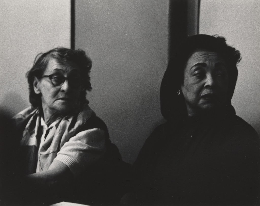 Untitled (two women looking over their shoulders)