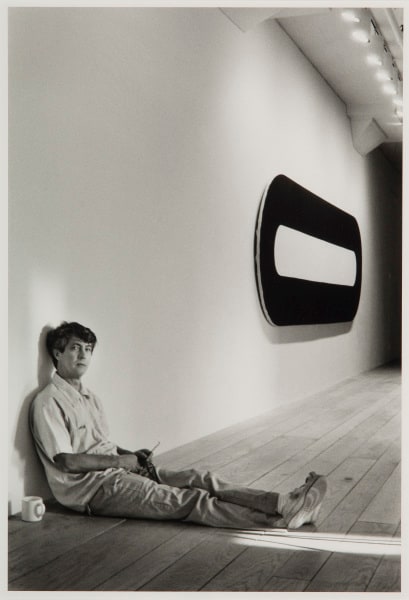 Richard Bellamy with Cup of Coffee and Michael Heizer Painting