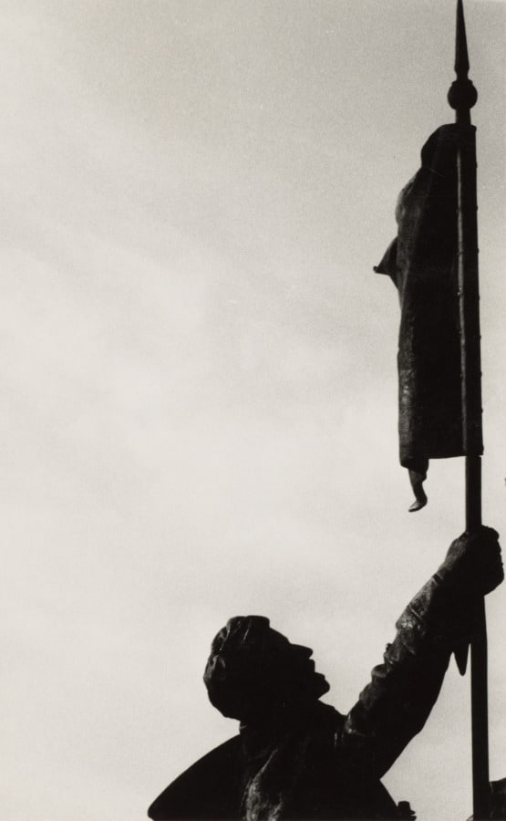 Statue of a man holding a flag at Washington, D.C. 
