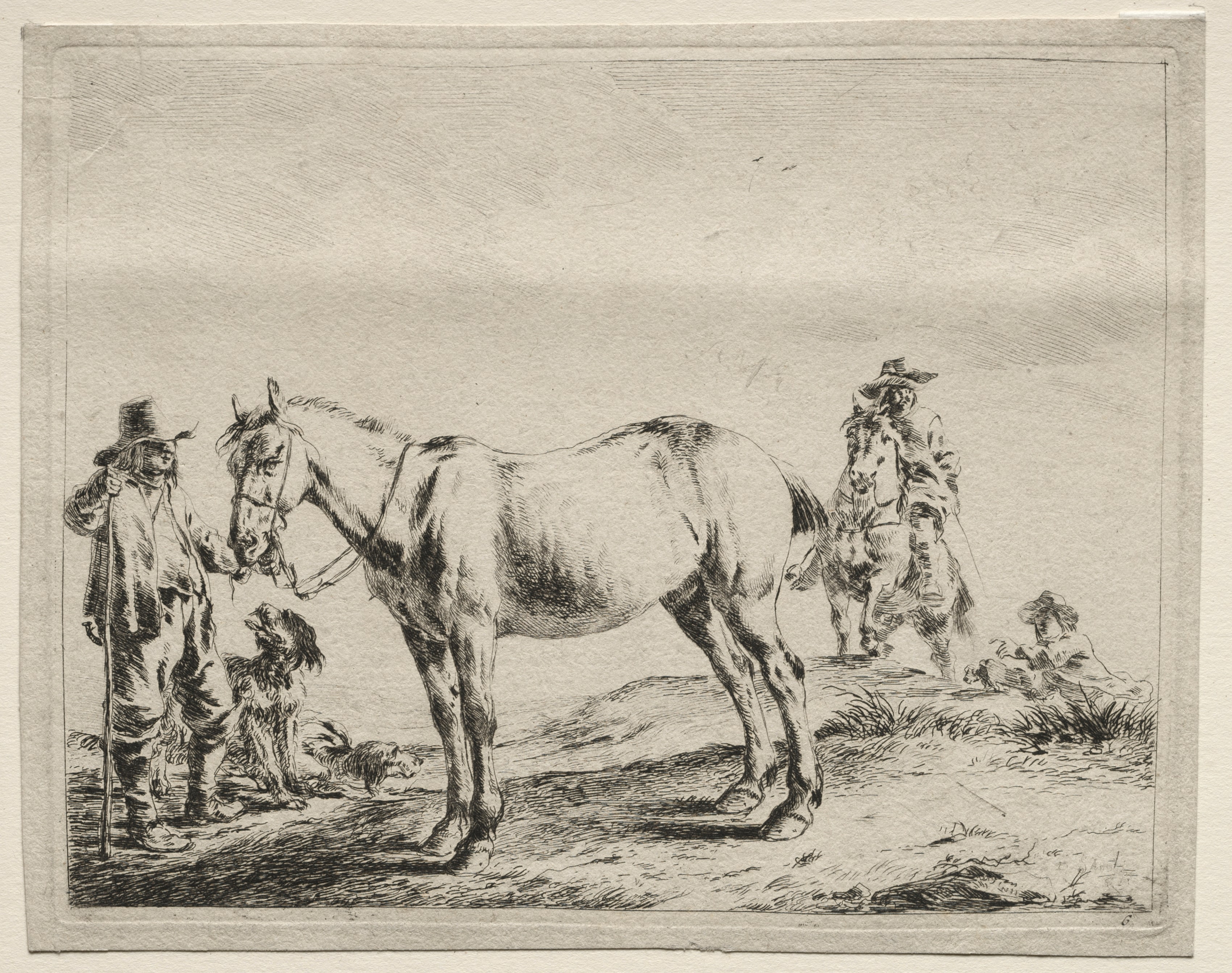 Man holding a horse by the bridle