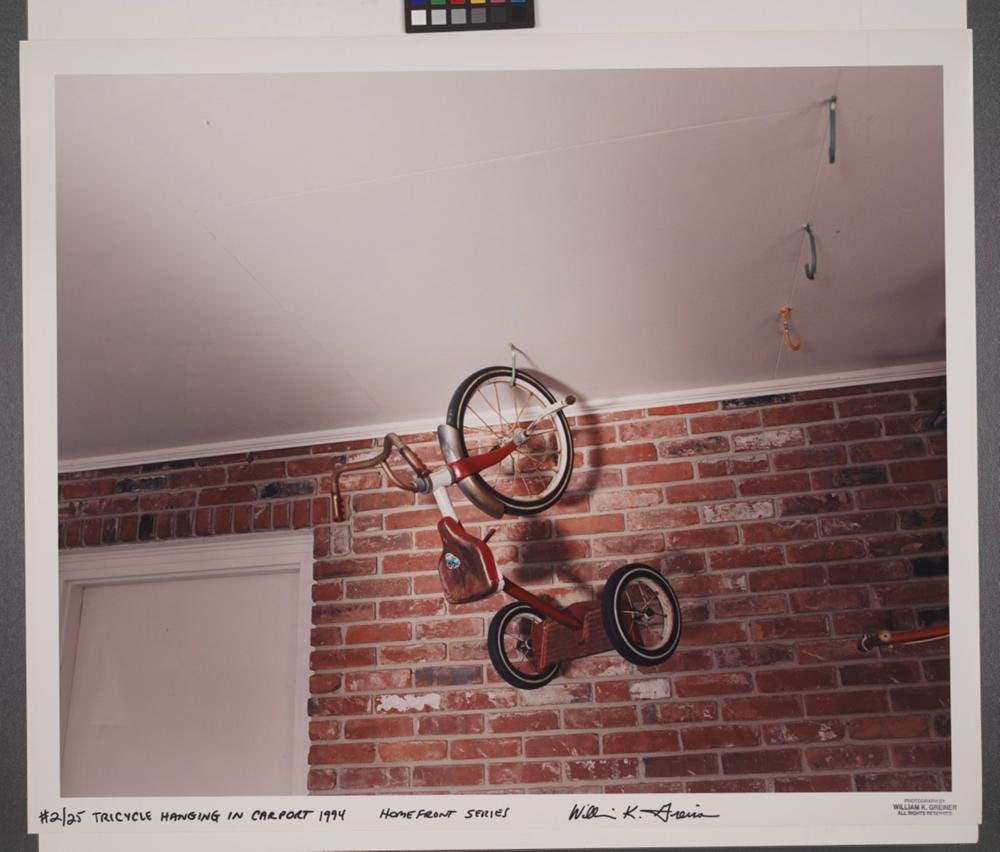 Tricycle Hanging in Carport