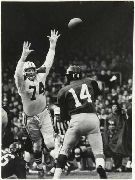 The Dallas Cowboys, in light jerseys, playing against the New York Giants, in dark jerseys
