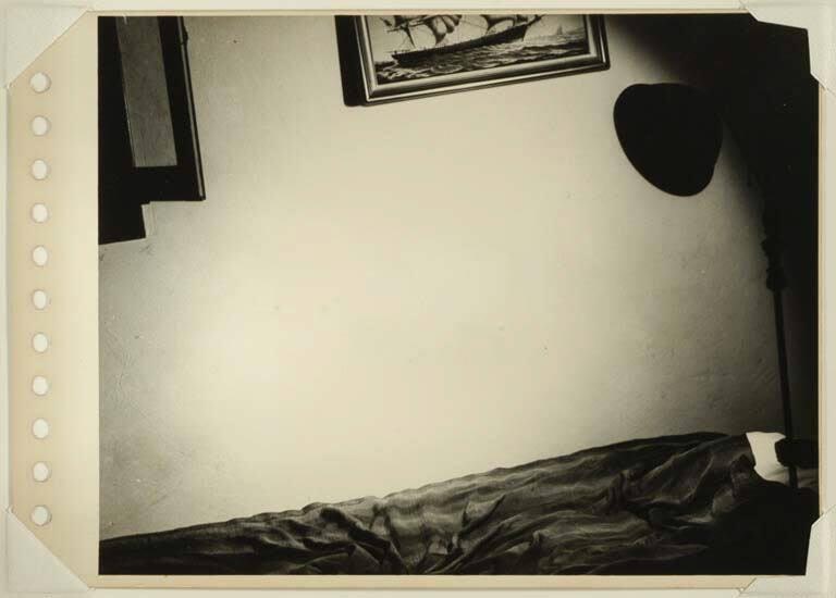 Untitled [Studio lamp and bed]