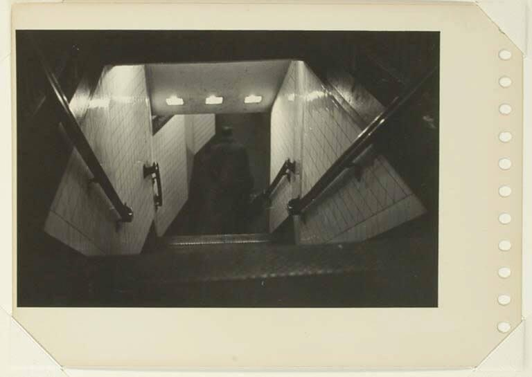 Untitled [Man descending subway steps]