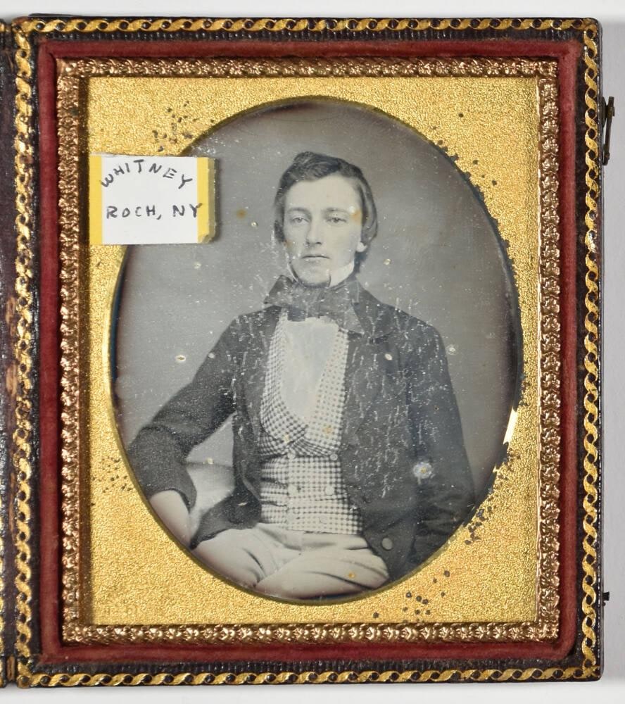 [Man Wearing Bow Tie and Checkered Vest]