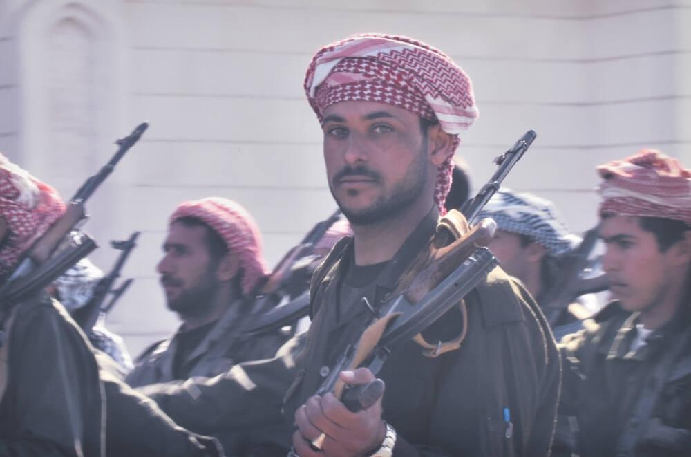 Al-Quds fighters - armed civilians- promise to meet U.S. and British invaders with "bullets, not flowers"