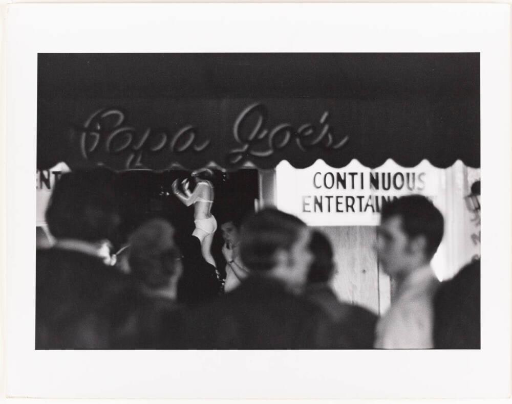 [Copa Joe's Continuous Entertainment Signs Stripper Dancing, Street Crowd Walks By]