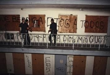 At an abandoned Westlake motel near Skid Row, de facto living quarters for dozens of people without homes, CRASH Unit officers search for a murder suspect, LAPD