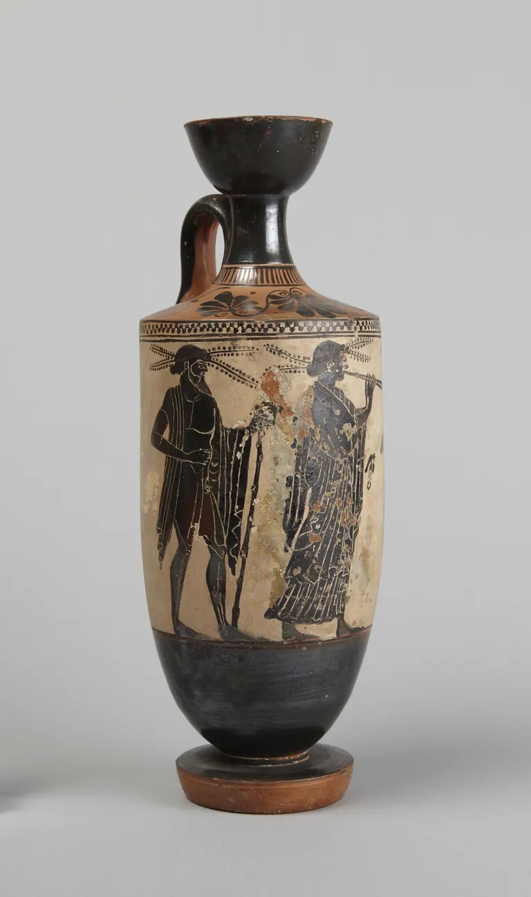 Black-figure lekythos: flutist between two men