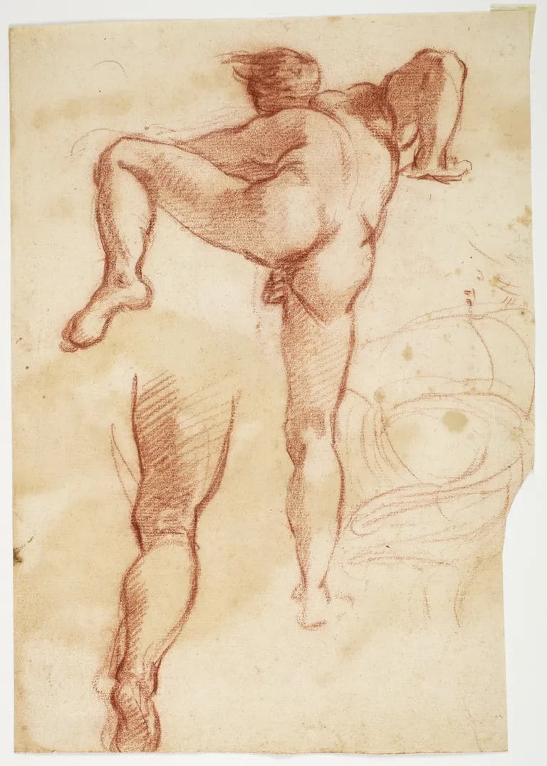 Nude figure climbing