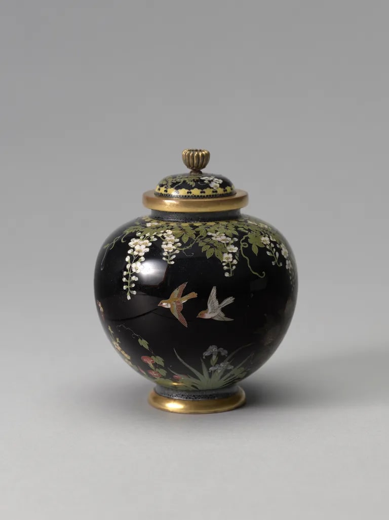 Jar with bud-form finial and bird and flower design