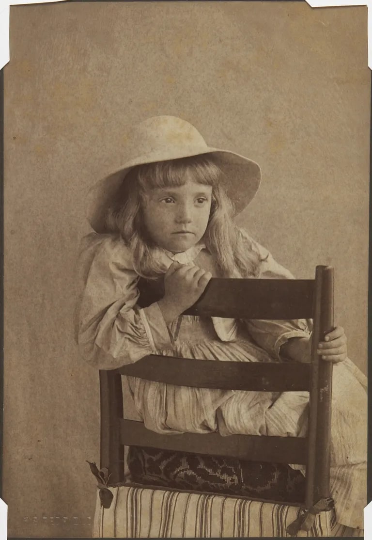 Mary W. Redfield with arm over back of chair
