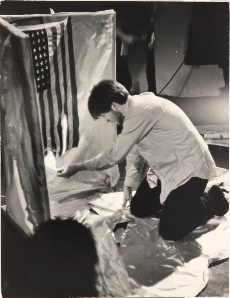José Rodriguez-Soltero burning American flag at Bridge Theatre on St. Mark's Place, New York City