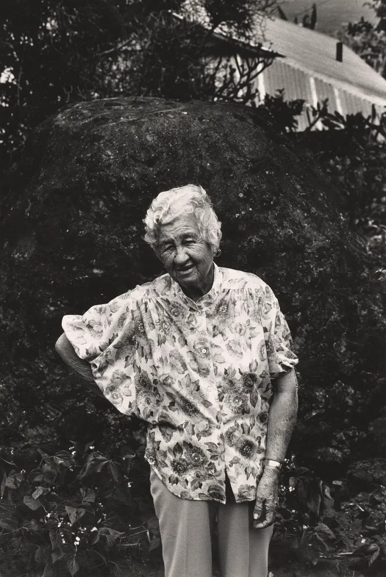 Santa Rodriguez Carvahlo, first generation Hawaiian-Puerto Rican, in front of her lava oven, Kukuihaele Plantation, Big Island, HI