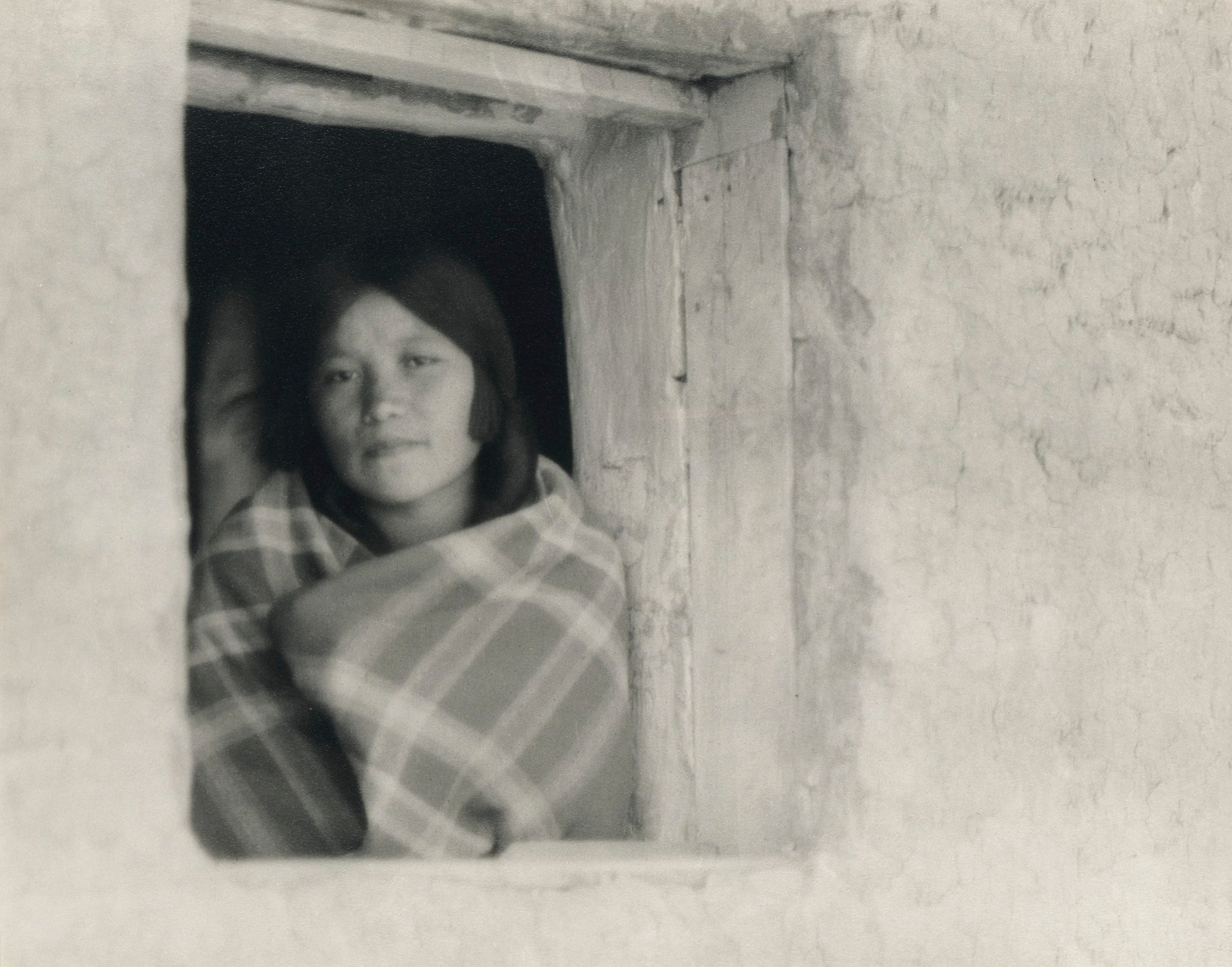 Young Woman in Pueblo Window