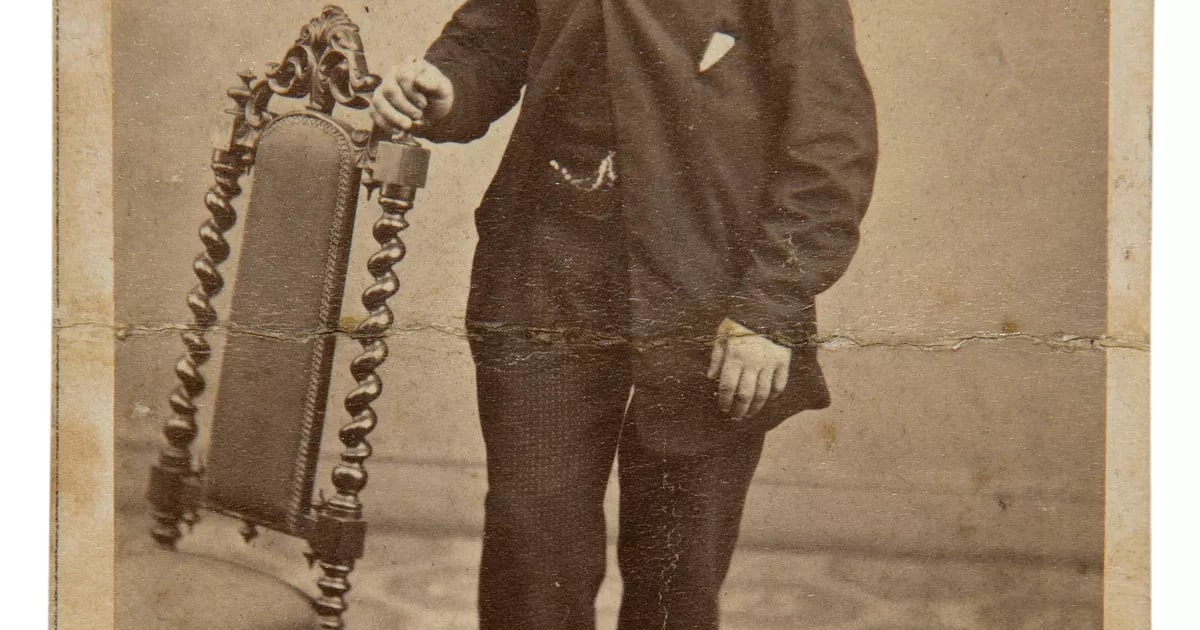Man standing beside chair