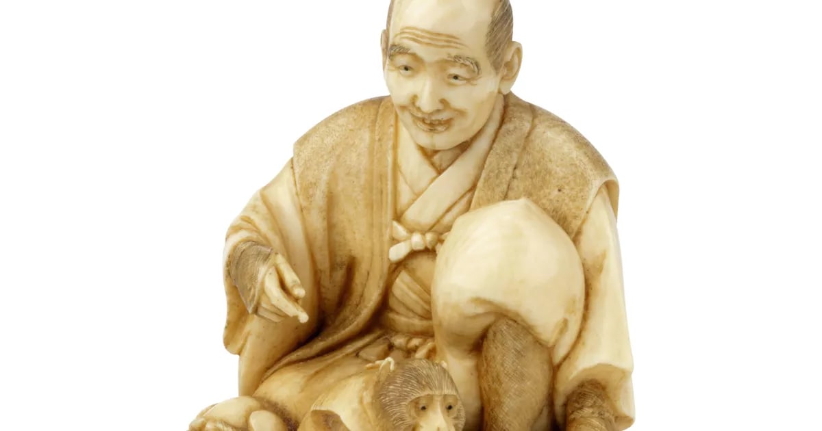 Okimono, monkey trainer (Sarumawashi) and lion dog (shishi) mask