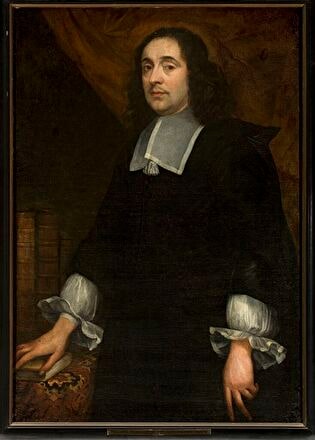 Portrait of a man at the table covered with a carpet
